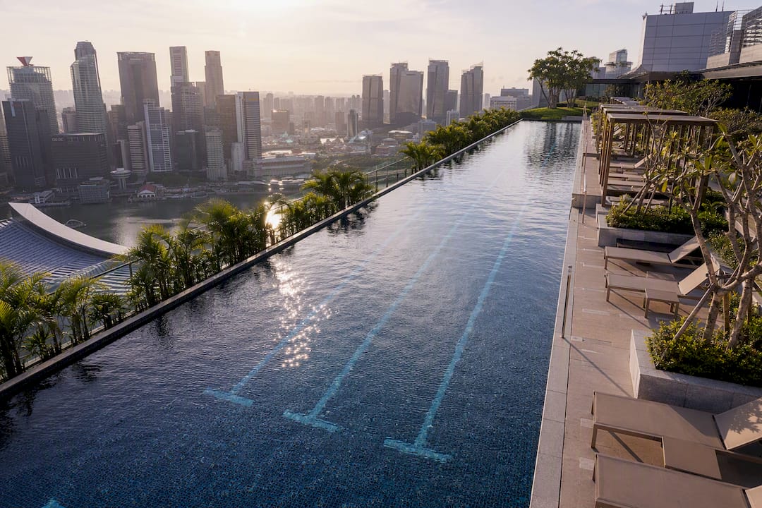 Condo sky terrace with lap pool and Marina Bay view